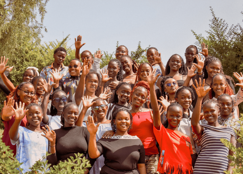 Groundbreaker Talents Scholars – Group Photo A group of young Groundbreaker Talents scholars standing together, waving and smiling at the camera.