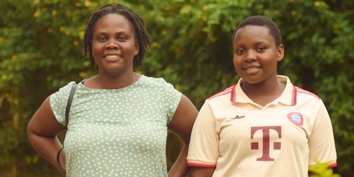 Mirembe and her sister standsing side by side