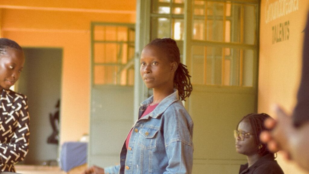 Young woman attending Groundbreaker Talents Application Day on campus in Uganda.